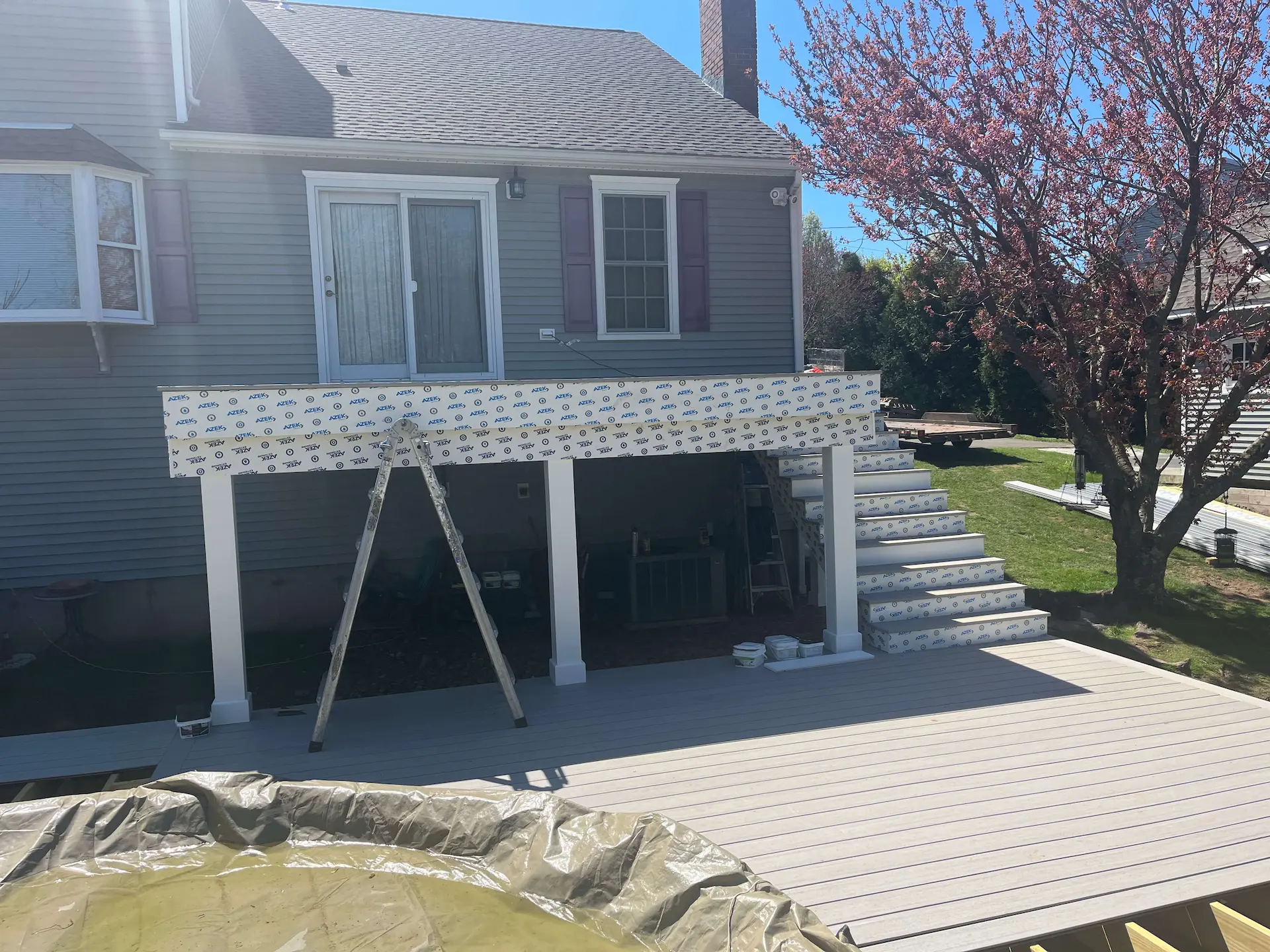 Staged TimberTech PVC pool deck Deck remodeling Deck construction Back yard upgrade Vinyl deck Vinyl decking Composite decking deck builder near me deck contractors near me PT deck with wire rails