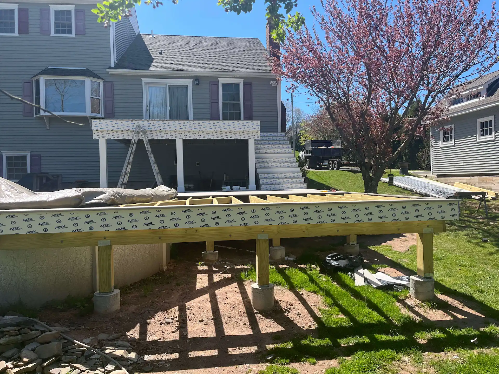Staged TimberTech PVC pool deck Deck remodeling Deck construction Back yard upgrade Vinyl deck Vinyl decking Composite decking deck builder near me deck contractors near me PT deck with wire rails