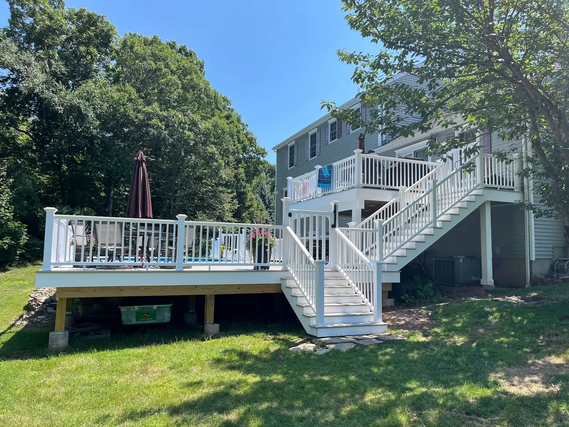 Staged TimberTech PVC pool deck Deck remodeling Deck construction Back yard upgrade Vinyl deck Vinyl decking Composite decking deck builder near me deck contractors near me PT deck with wire rails
