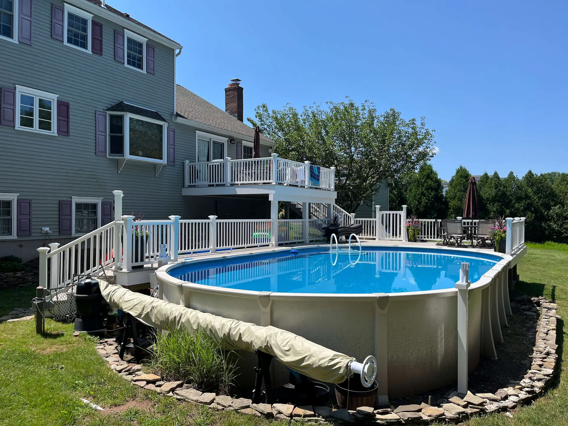 Staged TimberTech PVC pool deck Deck remodeling Deck construction Back yard upgrade Vinyl deck Vinyl decking Composite decking deck builder near me deck contractors near me PT deck with wire rails