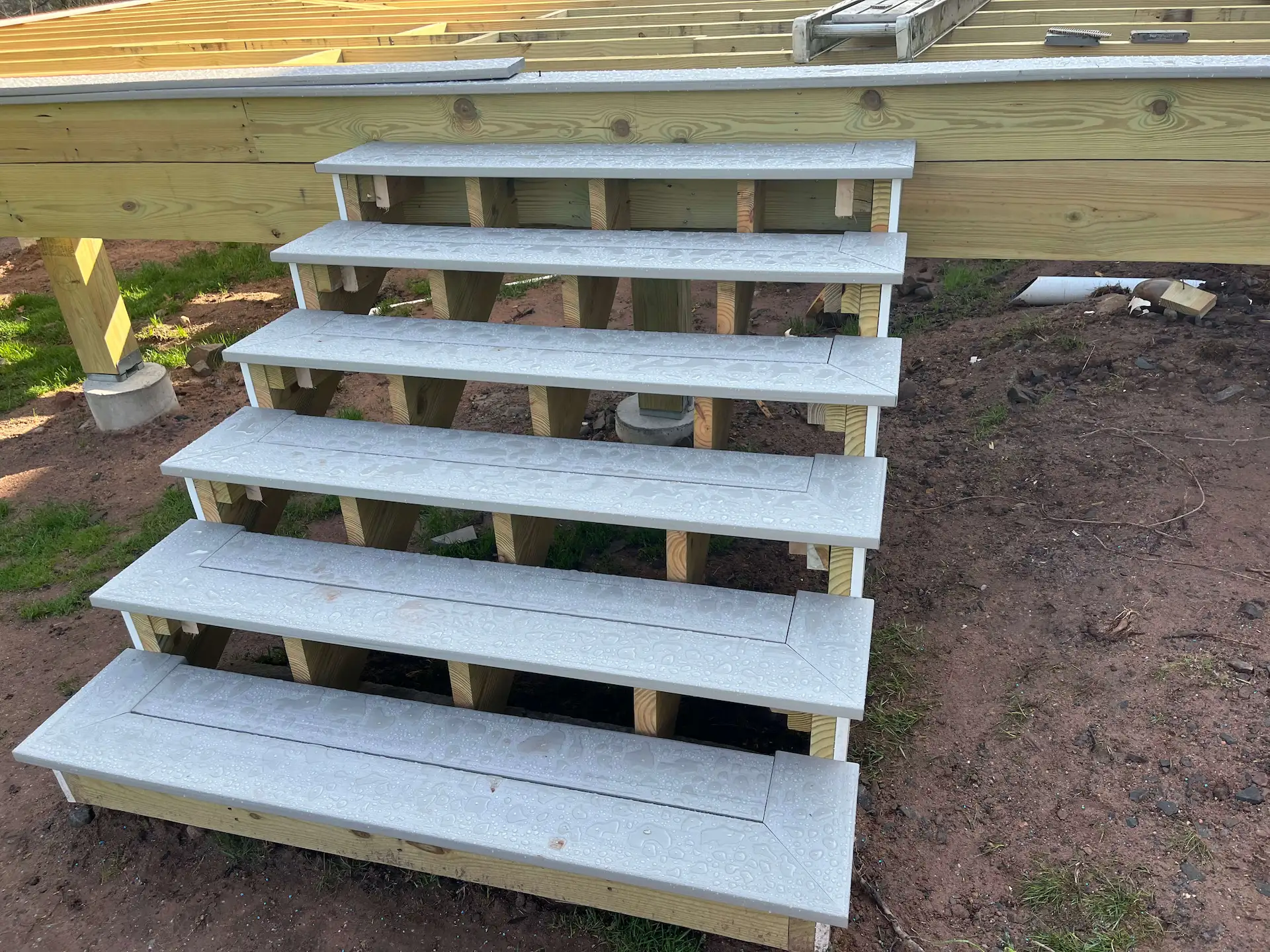 Staged TimberTech PVC pool deck Deck remodeling Deck construction Back yard upgrade Vinyl deck Vinyl decking Composite decking deck builder near me deck contractors near me PT deck with wire rails