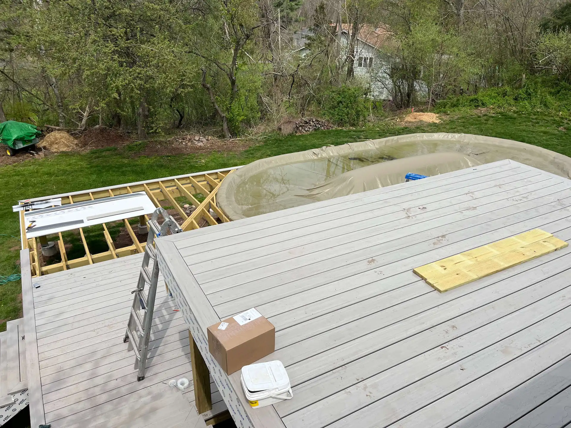 Staged TimberTech PVC pool deck Deck remodeling Deck construction Back yard upgrade Vinyl deck Vinyl decking Composite decking deck builder near me deck contractors near me PT deck with wire rails