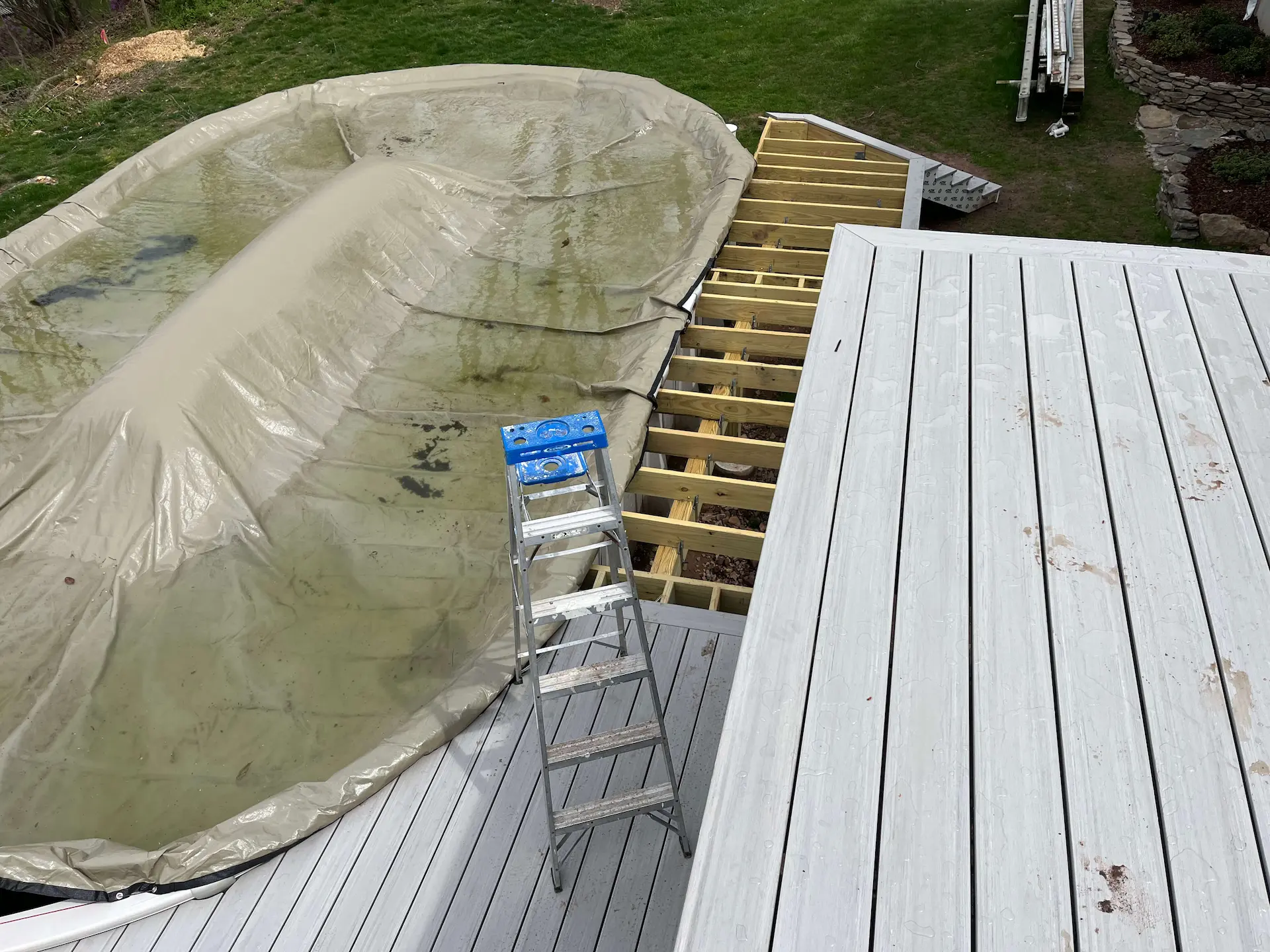 Staged TimberTech PVC pool deck Deck remodeling Deck construction Back yard upgrade Vinyl deck Vinyl decking Composite decking deck builder near me deck contractors near me PT deck with wire rails