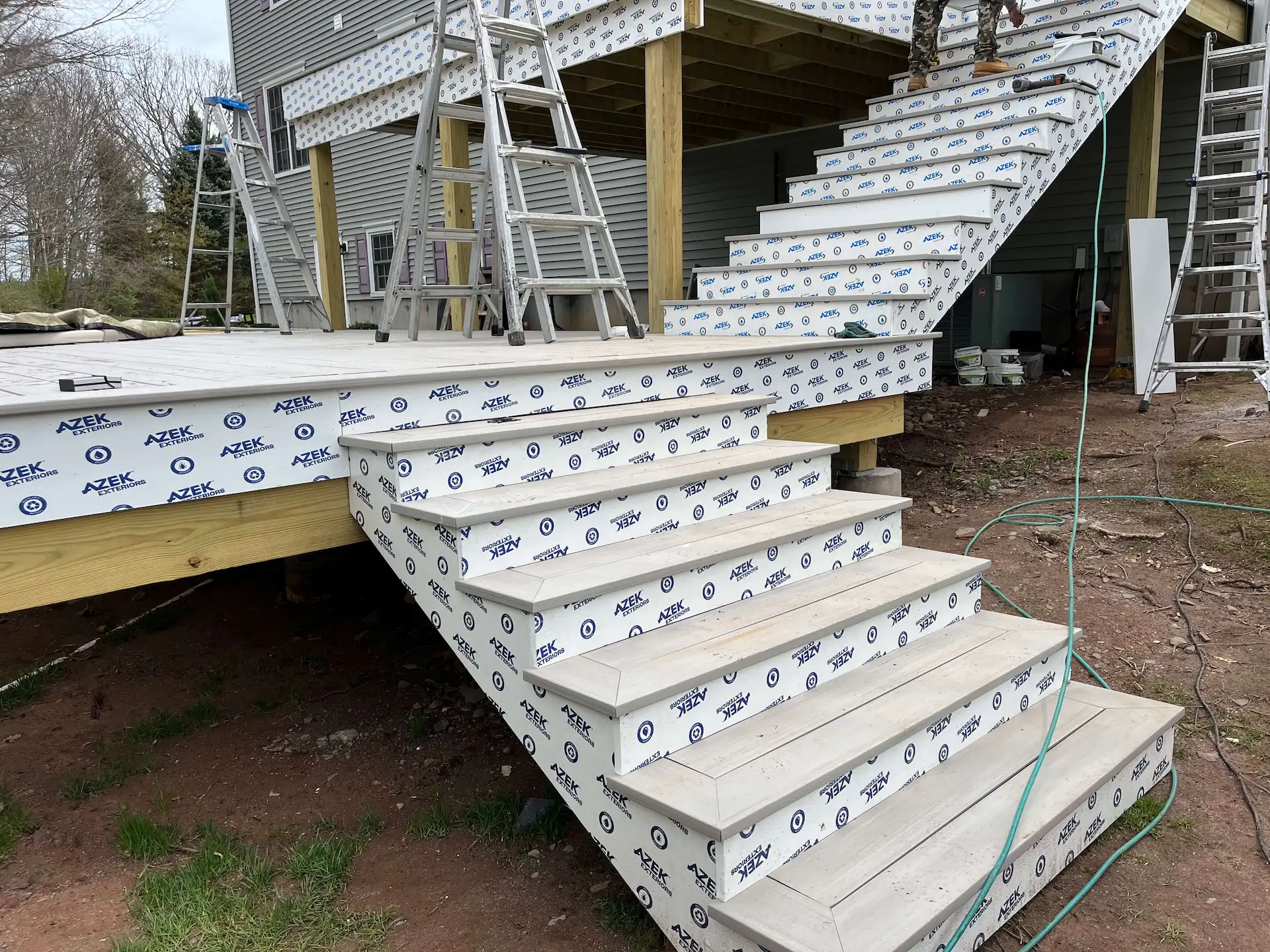 Staged TimberTech PVC pool deck Deck remodeling Deck construction Back yard upgrade Vinyl deck Vinyl decking Composite decking deck builder near me deck contractors near me PT deck with wire rails