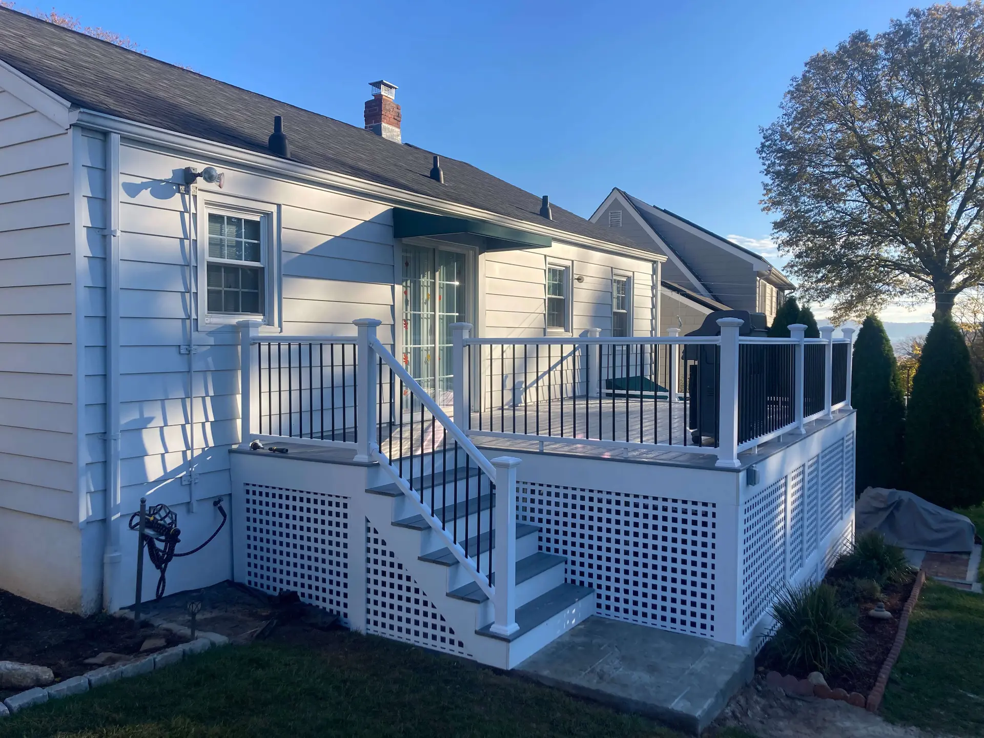 Enhance with square lattice Deck remodeling Deck construction Back yard upgrade Vinyl deck Vinyl decking Composite decking deck builder near me deck contractors near me PT deck with wire rails